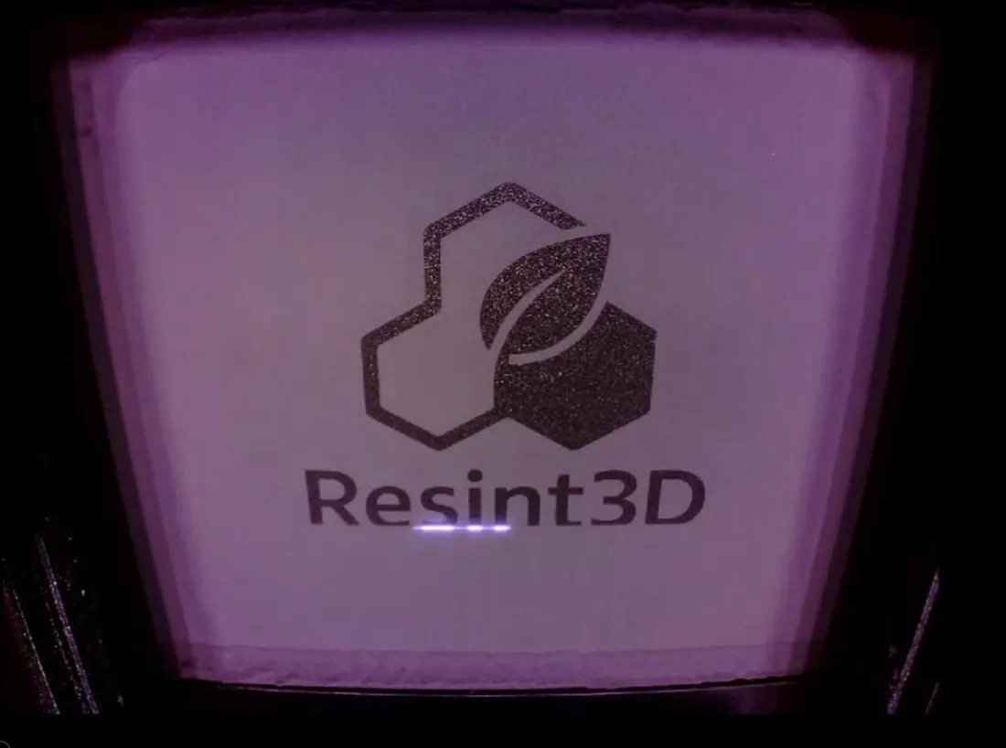 Laser sintering the Resint3D logo in Resint3D Nylon 12 inside a Formlabs Fuse 1